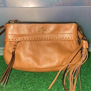 Brown fringed leather purse with zipper card compartment.